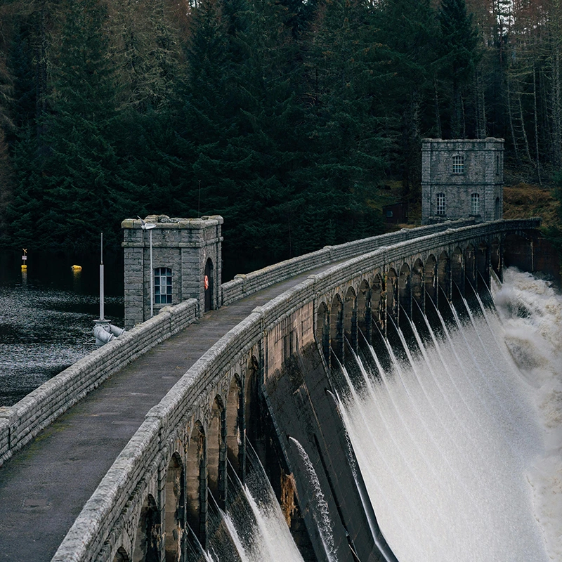 Photo of water going over a dam at a water company
